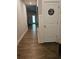 Hallway with wood floors leads to the rest of the home at 8315 Loch Lomand Ln, Winston, GA 30187
