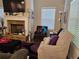 Comfortable living room with stone fireplace, modern decor, and plenty of natural light at 8315 Loch Lomand Ln, Winston, GA 30187
