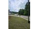 Quiet residential street with sidewalks and green lawns, offering a peaceful and Gathering-friendly environment at 8315 Loch Lomand Ln, Winston, GA 30187