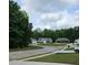 Charming neighborhood street with well-kept homes and landscaped yards, creating a welcoming community atmosphere at 8315 Loch Lomand Ln, Winston, GA 30187