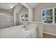 Bathroom with modern vanity, updated fixtures, and natural light from a large window at 3504 Benthollow Ln, Duluth, GA 30096