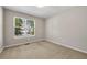 Bedroom with carpet, neutral wall color, and a view to the outside at 3504 Benthollow Ln, Duluth, GA 30096