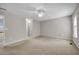 Spacious bedroom with neutral carpet, ceiling fan, and ample natural light at 3504 Benthollow Ln, Duluth, GA 30096