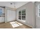 Sun-filled dining room with hardwood floors, pantry, large window and backyard view at 3504 Benthollow Ln, Duluth, GA 30096