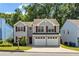 Charming two-story home featuring a two-car garage and gray siding, offering a welcoming curb appeal at 3504 Benthollow Ln, Duluth, GA 30096