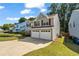 Well-kept two-story home with a spacious driveway and green lawn, offering a comfortable Gathering environment at 3504 Benthollow Ln, Duluth, GA 30096