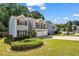 Inviting two-story home with manicured landscaping and a well-maintained lawn, creating a serene outdoor space at 3504 Benthollow Ln, Duluth, GA 30096