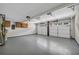 Spacious two car garage features cabinets and a new epoxy floor at 3504 Benthollow Ln, Duluth, GA 30096