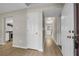 Charming hallway with luxury vinyl plank flooring and neutral paint at 3504 Benthollow Ln, Duluth, GA 30096