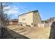 Expansive backyard showing home's exterior, a grassy lawn, and partial fencing at 3621 Guinevere Trce, Douglasville, GA 30135
