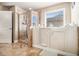 This bathroom features a walk-in shower with tiled walls, plus a walk-in bathtub with grab bars at 3621 Guinevere Trce, Douglasville, GA 30135