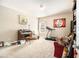 Large bedroom featuring a desk, treadmill, and sofa at 3621 Guinevere Trce, Douglasville, GA 30135