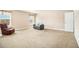 Large bonus room with carpet flooring, neutral paint, and two windows that provide natural light at 3621 Guinevere Trce, Douglasville, GA 30135