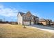 Lovely two-story home with brick and vinyl siding, two-car garage, and well-maintained lawn at 3621 Guinevere Trce, Douglasville, GA 30135