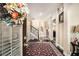 Spacious foyer featuring hardwood floors, a staircase, and a decorative wreath on the front door at 3621 Guinevere Trce, Douglasville, GA 30135