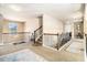Upstairs hallway with carpet, iron railing, and access to other rooms at 3621 Guinevere Trce, Douglasville, GA 30135