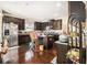 Kitchen showcases stainless steel appliances, a center island, and rich wood flooring at 3621 Guinevere Trce, Douglasville, GA 30135