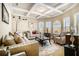 Cozy living room with coffered ceilings, large windows, and comfortable seating at 3621 Guinevere Trce, Douglasville, GA 30135