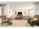 Bright living room featuring multiple sofas, a decorative area rug and neutral paint tones at 3621 Guinevere Trce, Douglasville, GA 30135