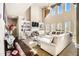 Sun-filled living room with fireplace, built-in shelves, and high ceilings at 3621 Guinevere Trce, Douglasville, GA 30135