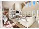 Bright living room with fireplace, built-in shelving, high ceilings, and large windows at 3621 Guinevere Trce, Douglasville, GA 30135