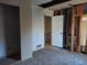 A bedroom needing renovation, with exposed framing and drywall, showing its potential for customization at 4195 Turner Dr, Cumming, GA 30040