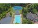 Aerial view of community pool, tennis courts, and parking at 5755 Vinings Place Se Ct, Mableton, GA 30126