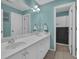 Stylish bathroom featuring double sinks, white cabinets, and neutral paint at 5755 Vinings Place Se Ct, Mableton, GA 30126