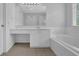 Bright bathroom features a soaking tub, glass-enclosed shower, and vanity with plenty of counter space at 5755 Vinings Place Se Ct, Mableton, GA 30126