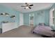Cozy bedroom with blue walls, carpeted floors, and an ensuite bathroom for added convenience at 5755 Vinings Place Se Ct, Mableton, GA 30126