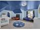 Fun bedroom with custom painted blue walls with star accents and two racecar beds at 5755 Vinings Place Se Ct, Mableton, GA 30126