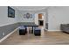The dining room has modern table and chairs with neutral paint at 5755 Vinings Place Se Ct, Mableton, GA 30126