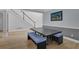 Dining area with modern table and stairs in the background at 5755 Vinings Place Se Ct, Mableton, GA 30126