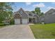 Charming home with three-car garage and manicured lawn at 5755 Vinings Place Se Ct, Mableton, GA 30126