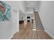 Inviting foyer showcasing hardwood floors and an elegant staircase at 5755 Vinings Place Se Ct, Mableton, GA 30126