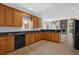 Well-lit kitchen featuring wooden cabinets and granite countertops at 5755 Vinings Place Se Ct, Mableton, GA 30126