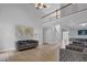 Open-concept layout with hardwood floors and a cozy seating area at 5755 Vinings Place Se Ct, Mableton, GA 30126