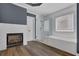 Bathroom featuring a fireplace, walk-in shower, and soaking tub at 5755 Vinings Place Se Ct, Mableton, GA 30126