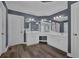 Beautiful bathroom featuring gray walls, dual sink vanity, and wood-look floors at 5755 Vinings Place Se Ct, Mableton, GA 30126