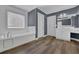 Bathroom featuring a soaking tub and vanity with a window providing natural light at 5755 Vinings Place Se Ct, Mableton, GA 30126