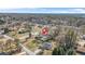 Aerial view of a property with a pool in the backyard, surrounded by residential homes and trees at 897 Marie Sw Ln, Conyers, GA 30094