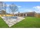 Spacious backyard featuring a refreshing in-ground pool, lush lawn, and privacy fence at 897 Marie Sw Ln, Conyers, GA 30094