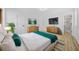 Bedroom featuring modern decor, natural light, and a glimpse into the en-suite bathroom at 897 Marie Sw Ln, Conyers, GA 30094