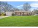 Charming brick ranch-style home with a well-manicured lawn and an attached garage at 897 Marie Sw Ln, Conyers, GA 30094