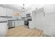 Modern kitchen with stainless steel appliances, stylish backsplash, and ample cabinet space at 897 Marie Sw Ln, Conyers, GA 30094