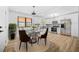 Modern kitchen with stainless steel appliances, white cabinetry, and a breakfast nook at 897 Marie Sw Ln, Conyers, GA 30094
