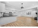 Open-concept living room and kitchen with modern finishes and plenty of natural light at 897 Marie Sw Ln, Conyers, GA 30094