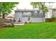 Back exterior view showcases the deck, lawn, and overall backyard of this lovely home at 1160 Haven Brook Ne Way, Brookhaven, GA 30319