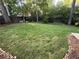 Spacious backyard featuring lush green grass, mature trees, and a private fenced perimeter at 1160 Haven Brook Ne Way, Brookhaven, GA 30319
