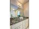 Modern bathroom with glass bowl sinks, granite countertop, and custom cabinetry for a luxurious feel at 1160 Haven Brook Ne Way, Brookhaven, GA 30319